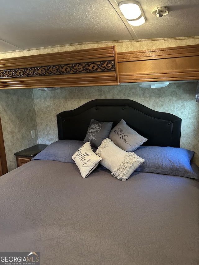 bedroom featuring a textured ceiling