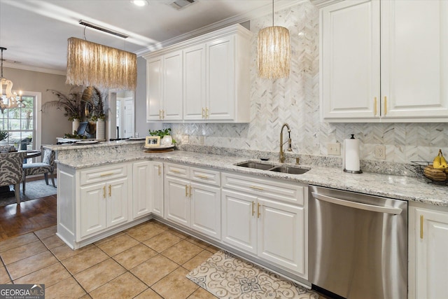 kitchen with pendant lighting, ornamental molding, white cabinetry, a sink, and dishwasher