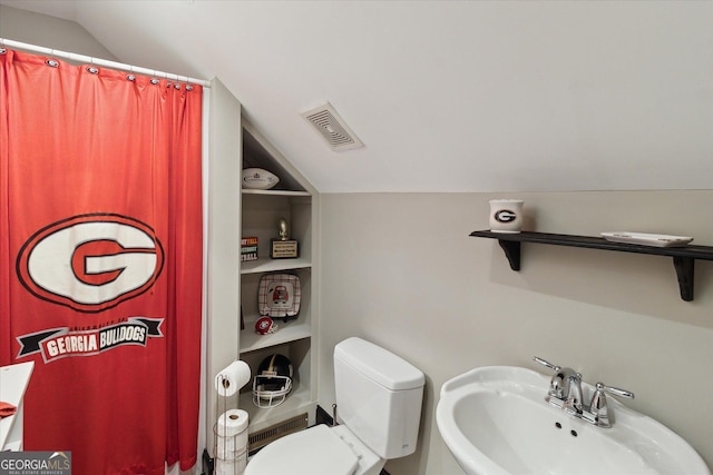 full bath with lofted ceiling, visible vents, a sink, and built in features