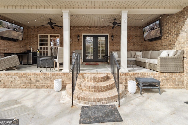 view of patio featuring french doors, an outdoor living space, and a ceiling fan