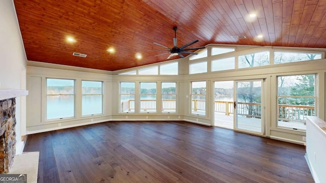 unfurnished sunroom featuring lofted ceiling, wood ceiling, visible vents, and a stone fireplace