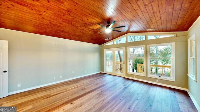 empty room with light wood-style floors, lofted ceiling, wood ceiling, and baseboards