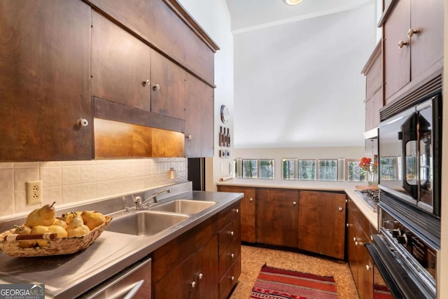 kitchen with wall oven, a sink, light countertops, black microwave, and backsplash