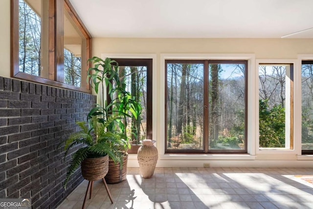 unfurnished sunroom with a wealth of natural light