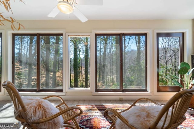 sunroom with a ceiling fan