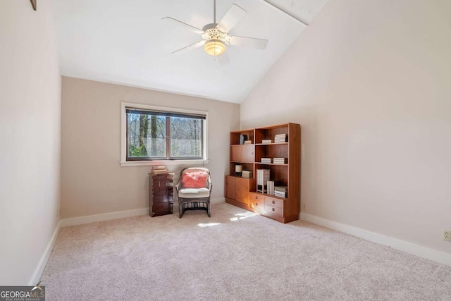 living area featuring baseboards, high vaulted ceiling, a ceiling fan, and light colored carpet