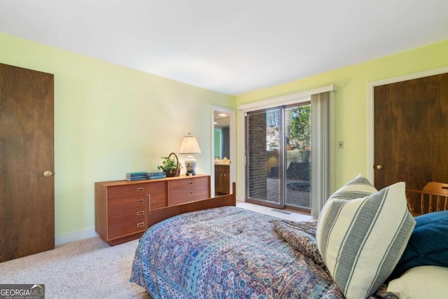 bedroom with access to outside, light carpet, and baseboards