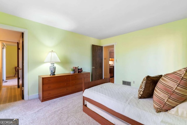 bedroom with light carpet and visible vents