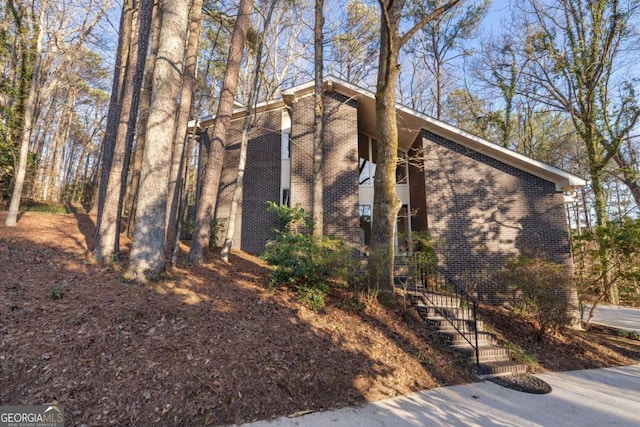 view of home's exterior with brick siding