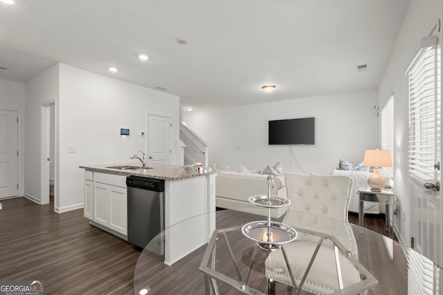 interior space featuring dark wood-type flooring, recessed lighting, visible vents, and baseboards