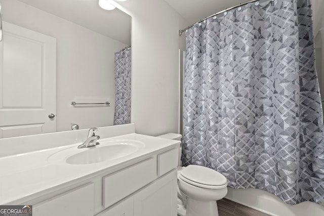 bathroom with toilet, a shower with shower curtain, and vanity