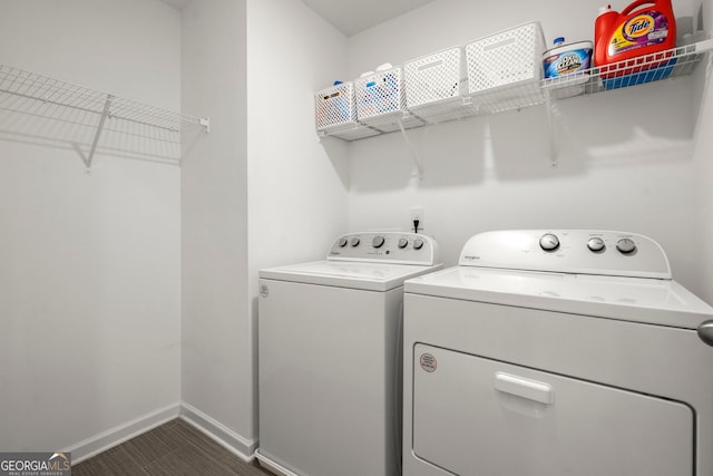 laundry room with laundry area, baseboards, and washing machine and clothes dryer