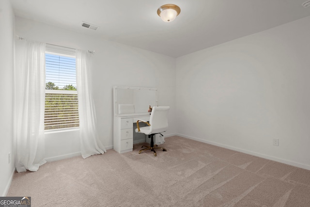 office with carpet floors, visible vents, and baseboards