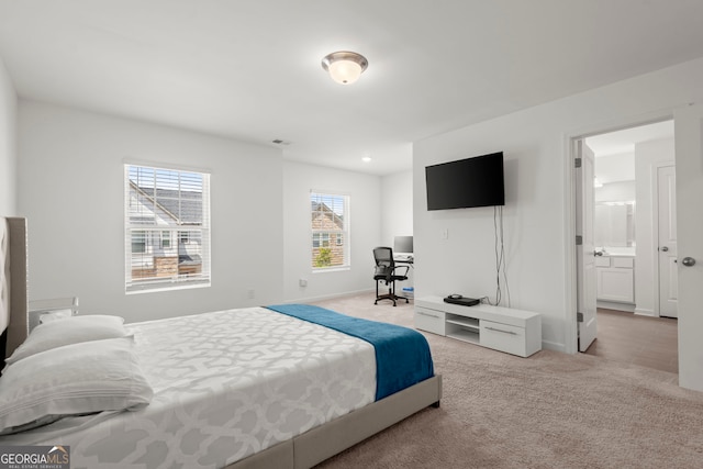 bedroom featuring light colored carpet, visible vents, and baseboards