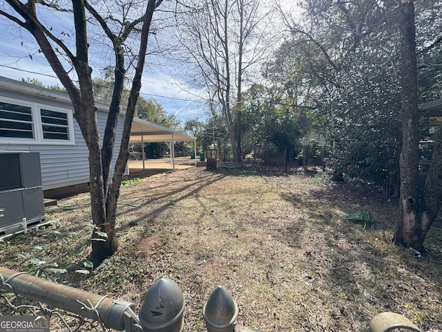 view of yard with a carport