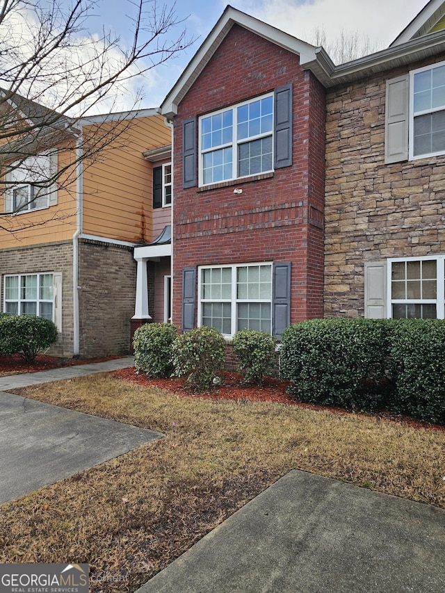 view of front of property featuring brick siding