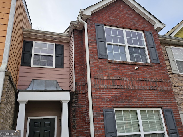 view of property exterior featuring brick siding