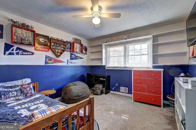 bedroom featuring baseboards, visible vents, a textured ceiling, and light colored carpet