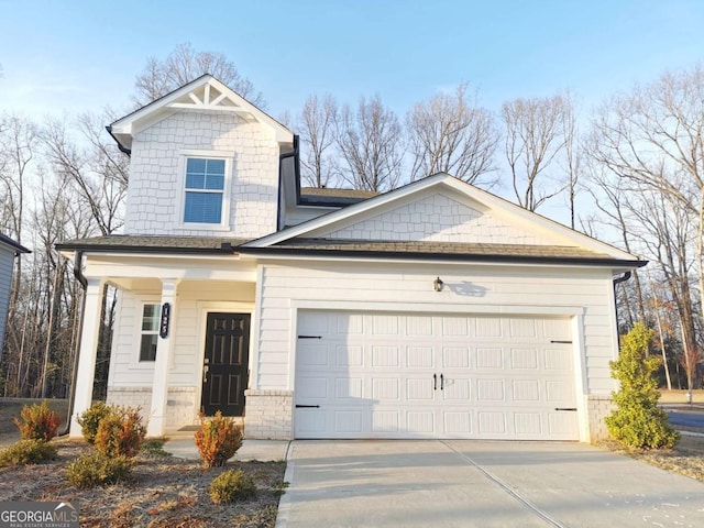 view of front facade featuring a garage and concrete driveway