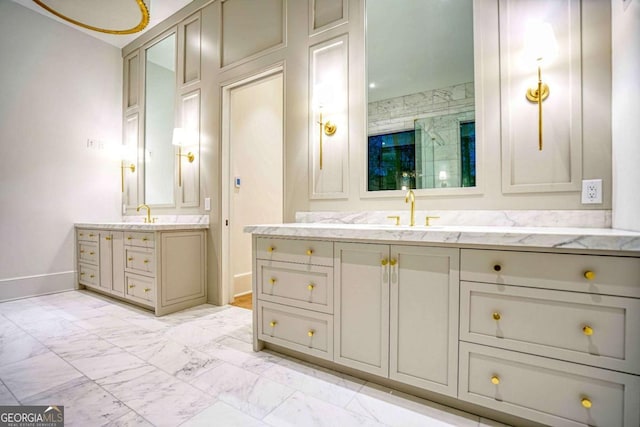 full bathroom featuring two vanities, a sink, baseboards, marble finish floor, and a shower stall