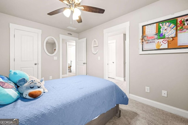 bedroom featuring baseboards, ceiling fan, and light colored carpet