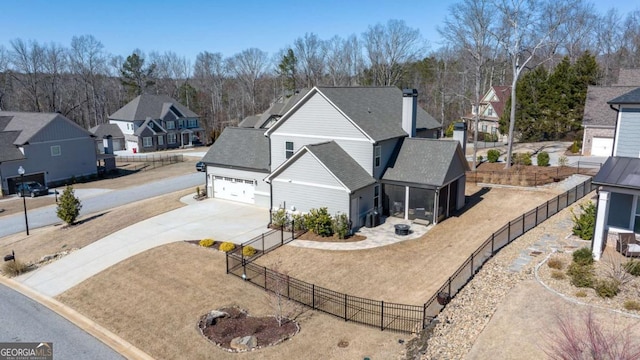 birds eye view of property with a residential view