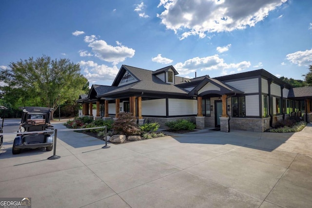 view of front of home with stone siding