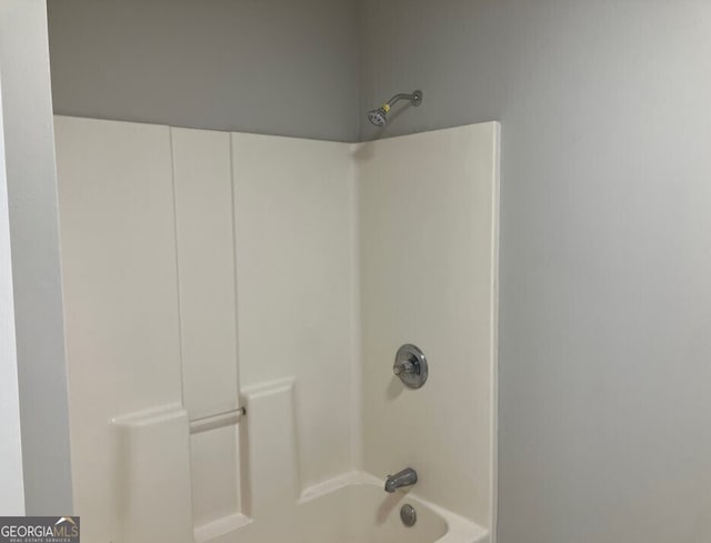 bathroom with shower / bath combination