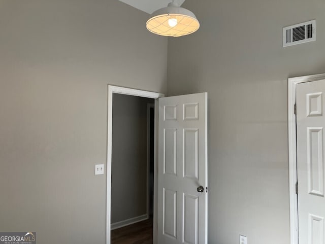 unfurnished bedroom with baseboards and visible vents