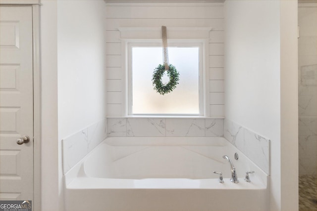 full bathroom featuring a garden tub