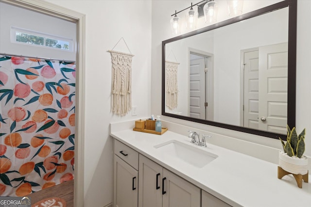 full bathroom with vanity and a shower with curtain