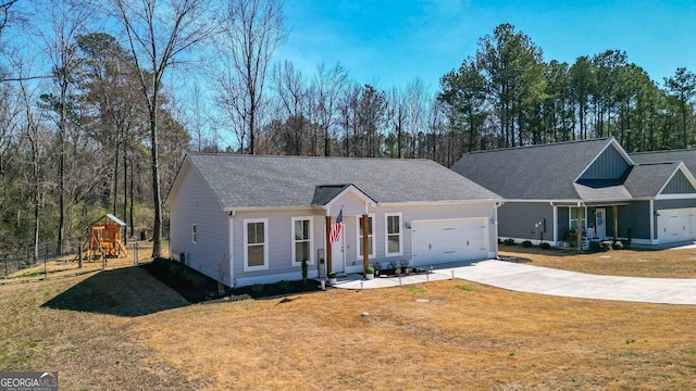 ranch-style house featuring concrete driveway, a playground, an attached garage, and a front lawn