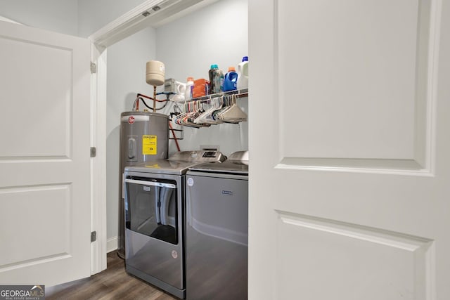 laundry room with laundry area, dark wood-type flooring, and independent washer and dryer