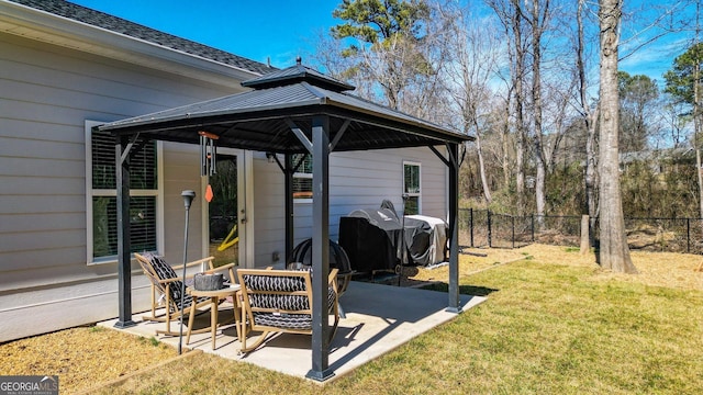 view of patio with fence and a gazebo