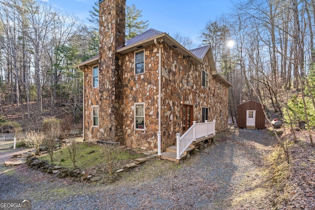 3360 Turniptown Rd, Ellijay, GA 30536 - view of side of home featuring stone siding and metal roof