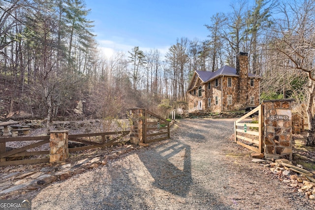 3360 Turniptown Rd, Ellijay, GA 30536 - view of dirt / gravel road with a gated entry and a gate