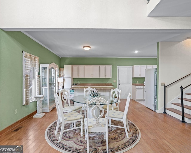 3360 Turniptown Rd, Ellijay, GA 30536 - dining room featuring light wood-style floors, stairs, crown molding, baseboards, and recessed lighting