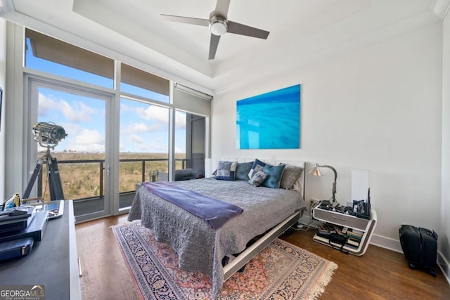 3630 Peachtree Rd NE Unit 1809, Atlanta, GA 30326 - bedroom featuring access to exterior, a tray ceiling, wood finished floors, and ceiling fan