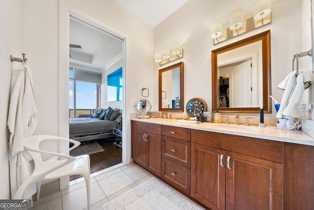 3630 Peachtree Rd NE Unit 1809, Atlanta, GA 30326 - ensuite bathroom featuring double vanity, tile patterned flooring, and crown molding