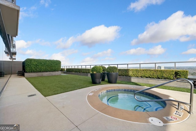 3630 Peachtree Rd NE Unit 1809, Atlanta, GA 30326 - view of swimming pool with a hot tub and a yard