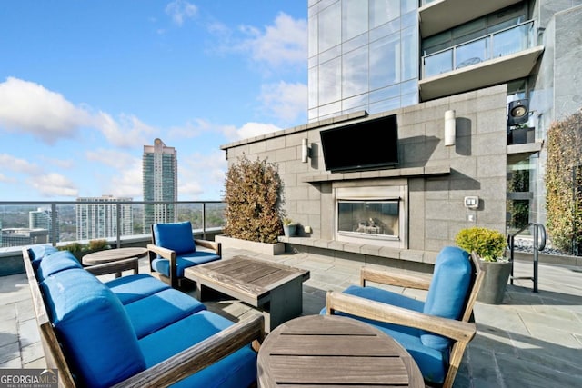 3630 Peachtree Rd NE Unit 1809, Atlanta, GA 30326 - view of patio featuring an outdoor living space with a fireplace