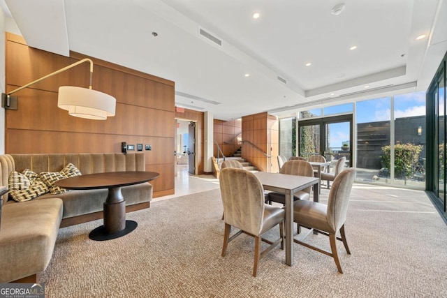 3630 Peachtree Rd NE Unit 1809, Atlanta, GA 30326 - dining room with light carpet, recessed lighting, a raised ceiling, and wooden walls