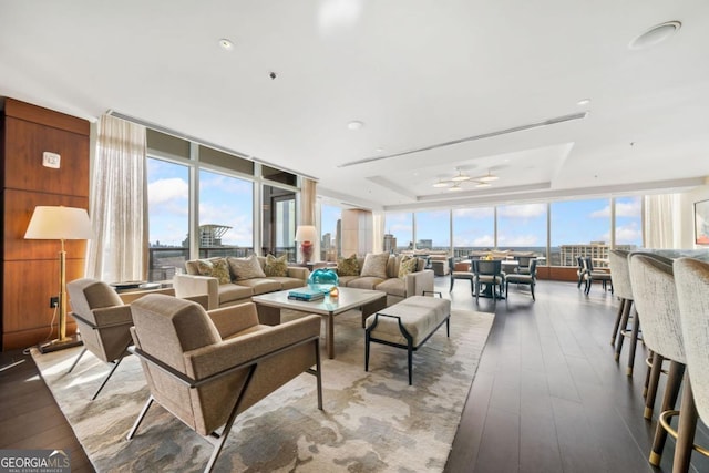 3630 Peachtree Rd NE Unit 1809, Atlanta, GA 30326 - living room with a wall of windows, wood finished floors, and a raised ceiling