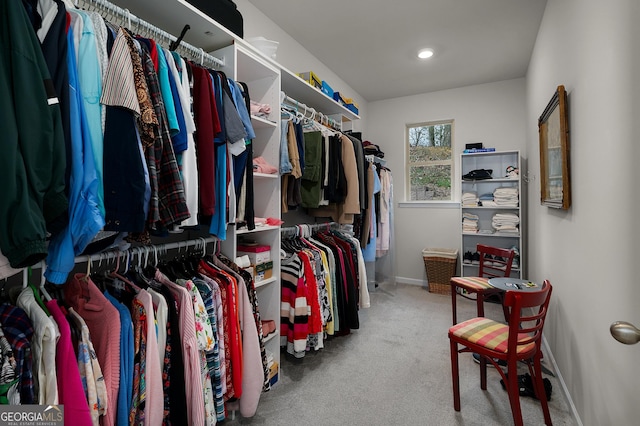 walk in closet featuring carpet floors