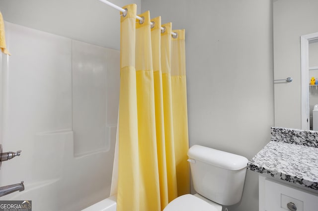 bathroom with vanity, toilet, and shower / bath combo with shower curtain