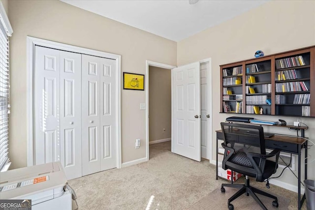 office area featuring light colored carpet and baseboards