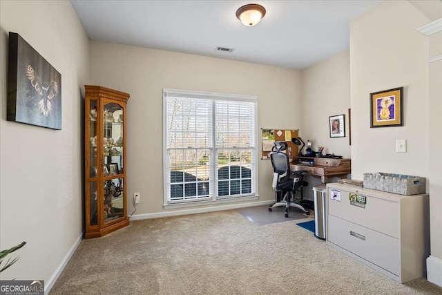 office area featuring carpet floors, baseboards, and visible vents