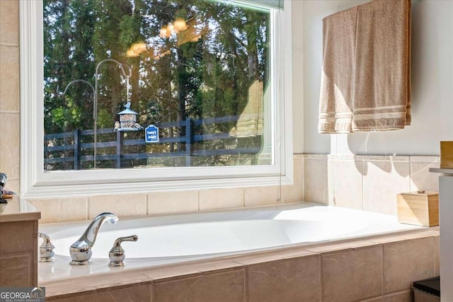 full bathroom featuring tiled tub