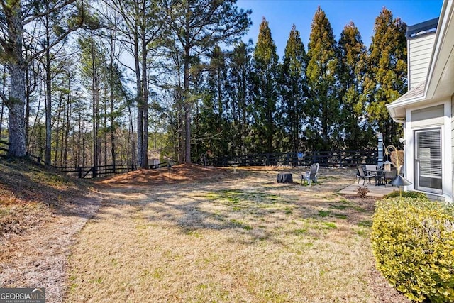 view of yard featuring a patio area and a fenced backyard