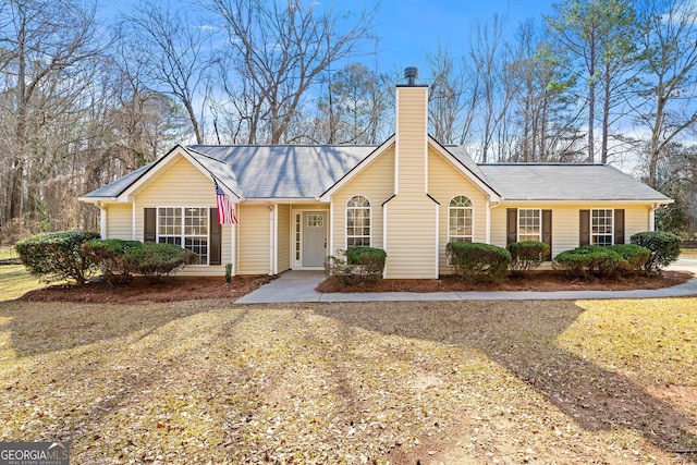 ranch-style house with a chimney